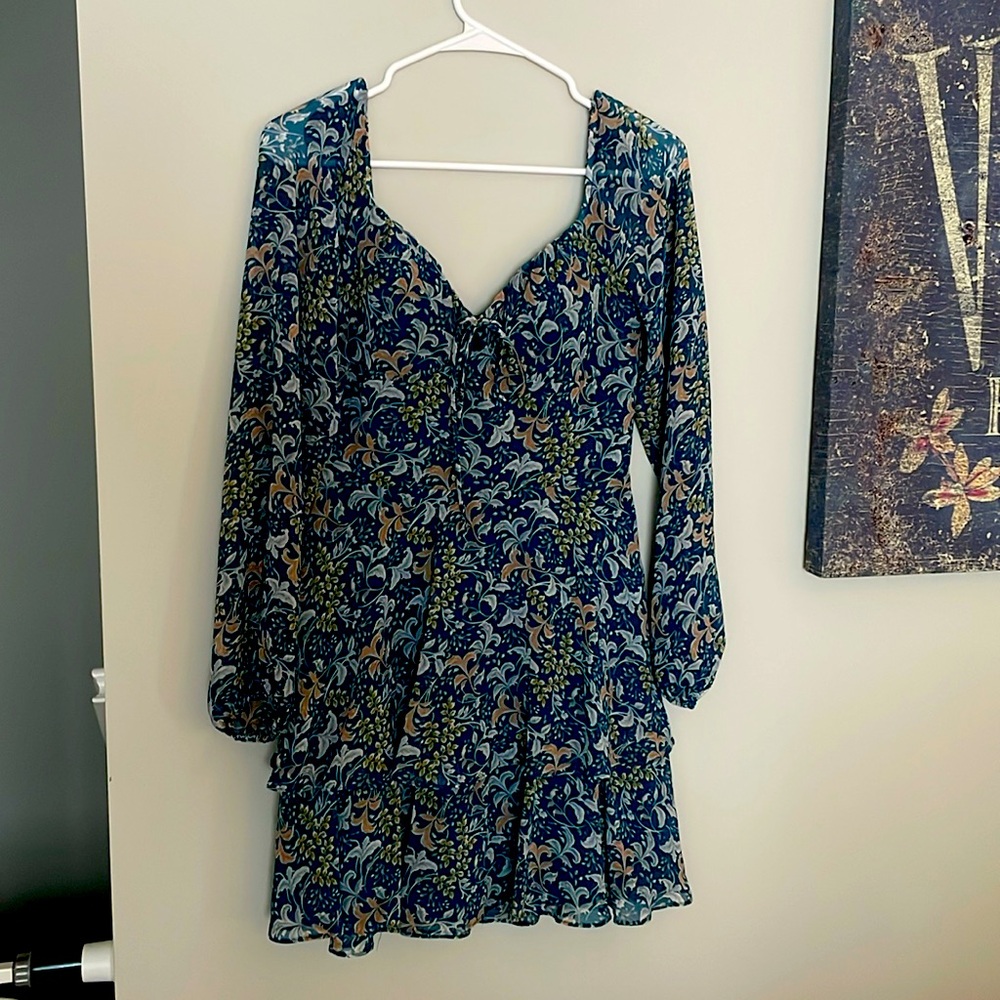 Floral print Fall mini dress with sheer sleeves and built in bra cups.